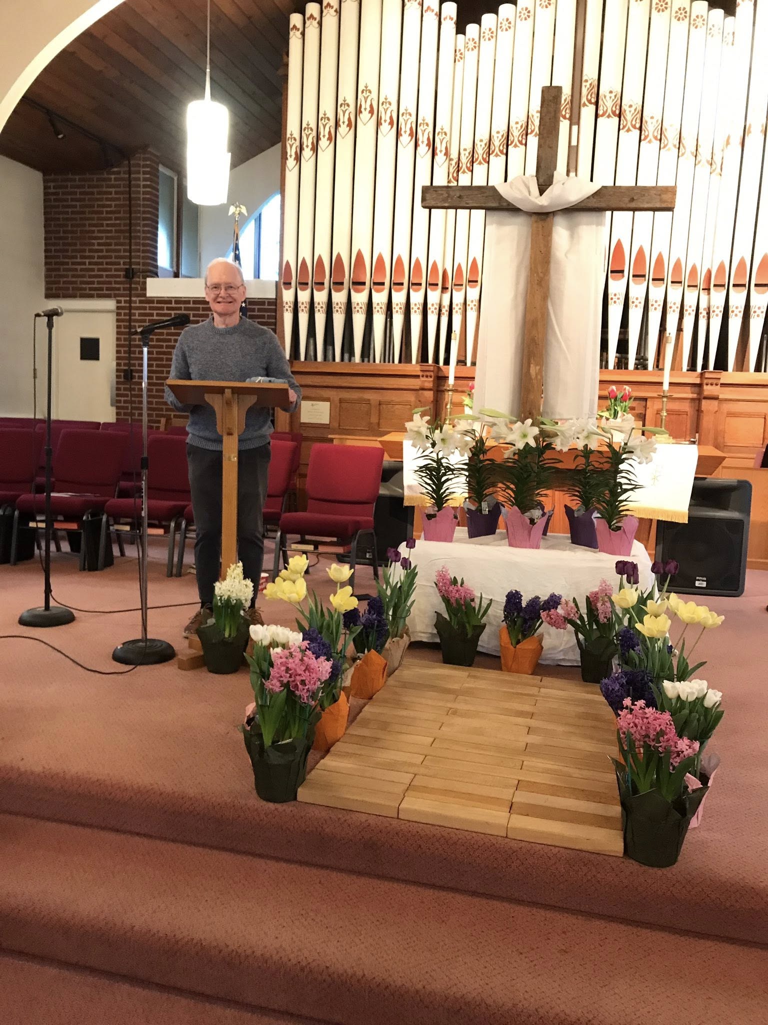 Easter morning at Lakewood UMC — lilies, hyacinths, and the wooden cross